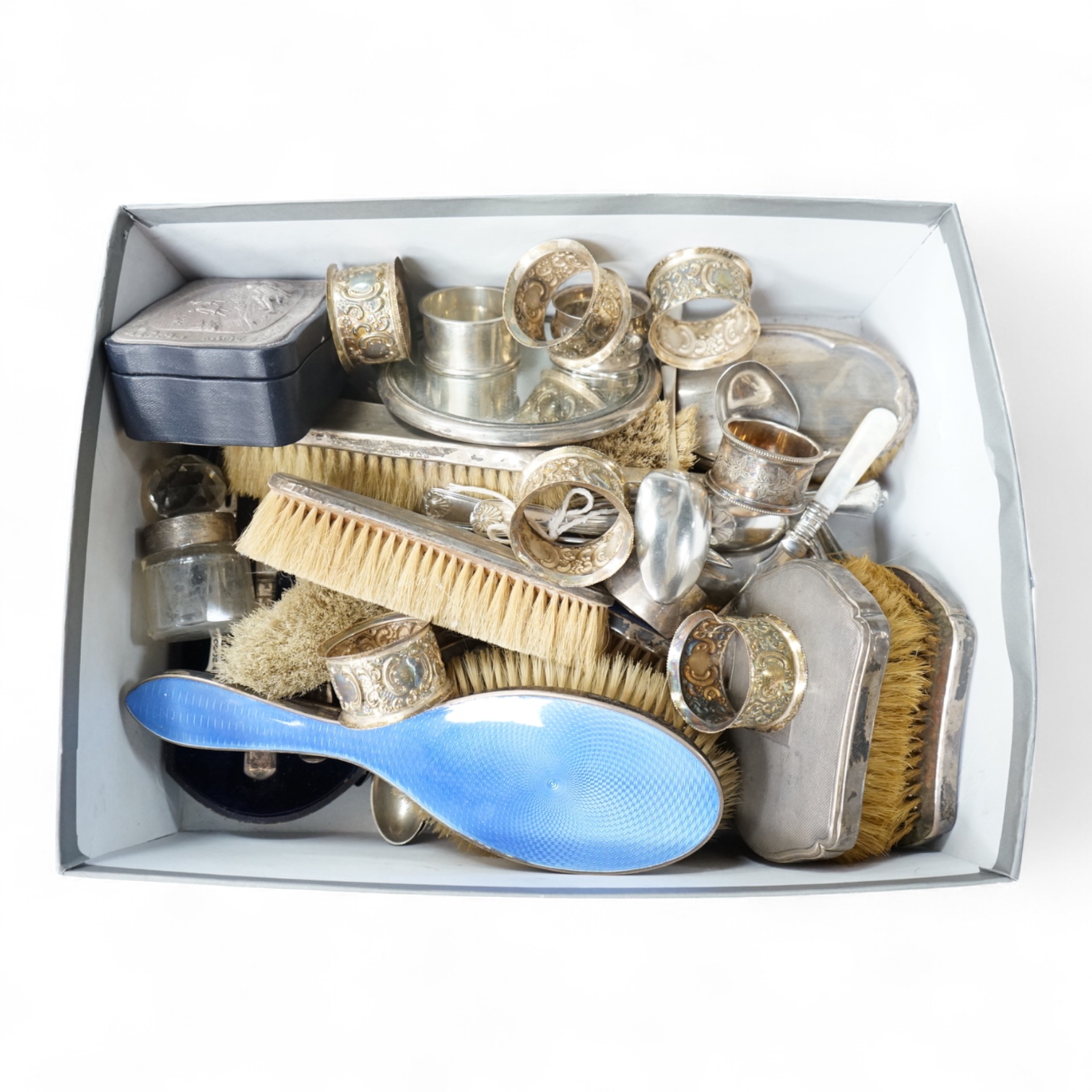 A quantity of assorted silver items including four silver and enamel clothes or hair brushes by Charles S. Green & Co Ltd, Birmingham, 1923, nine other mounted dressing table items, a Victorian christening trio, a set of